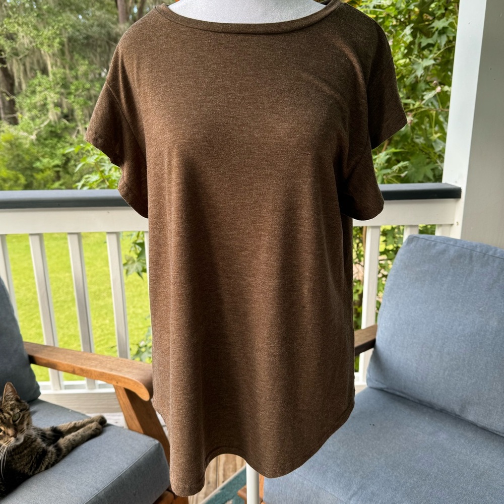Brown tee shirt with ruffled sleeves. Never worn.  Too big